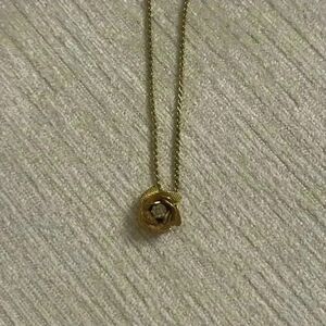 Gold tone rose necklace